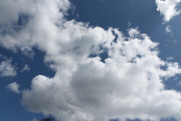 Clouds in a blue sky ,white fluffy clouds on a back ground of blue sky on a summers day Knottingley West Yorkshire In UK
