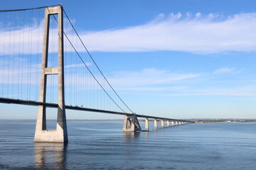 Denmark's Great Belt Suspension Bridge seen from the sea on a sunny day