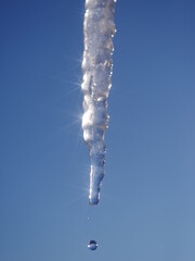 A long icicle hanging from the sky
