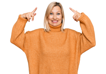 Middle age caucasian woman wearing casual winter sweater smiling pointing to head with both hands finger, great idea or thought, good memory