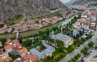 Fascinating view of the city of Amasya, also known as the city of princes. wonderful clouds coming out of the mountains. YESILIRMAK river.