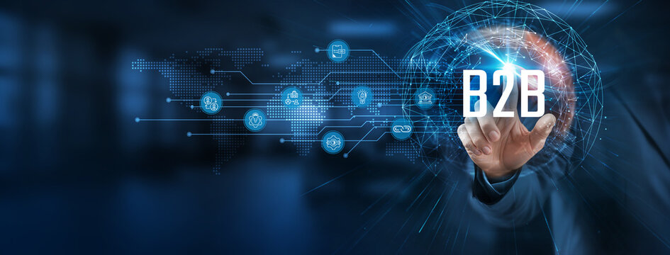 A smart solution to optimize B2B business. Businessman points at a virtual network connecting service with graphical icons in technology, finance, manufacturing, healthcare, and retail industries.