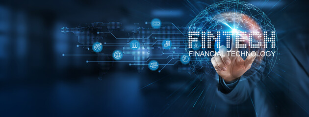 Fintech provides a smart solution to streamline financial services. Businessman point at virtual fintech network connecting service with graphical icons in banking, investment, insurance industry.