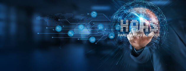 The HaaS (Hardware as a Service) smart solution to modernize businesses. Businessman points at a virtual HaaS network connecting service with graphical icons in technology, healthcare, and industry.