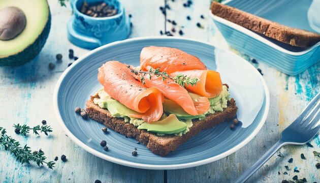 Sandwich with salmon, avocado and spices, homemade bread, vintage toned
