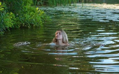 Fototapeta premium Natural appearance lady in the lake. Femininity concept, naturally skin