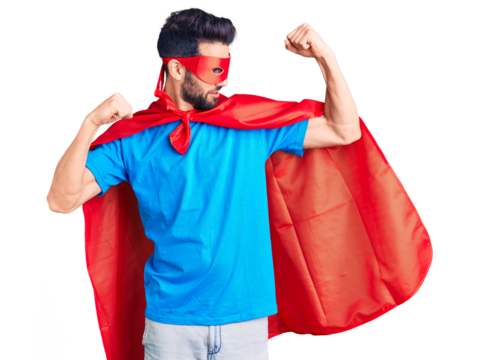 Young handsome man with beard wearing super hero costume showing arms muscles smiling proud. fitness concept.