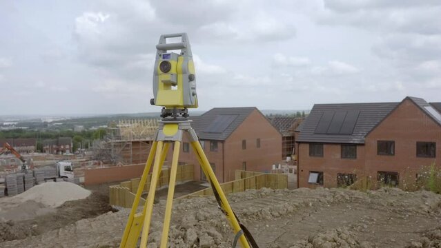 Surveying New Homes Construction Site on Cloudy Day