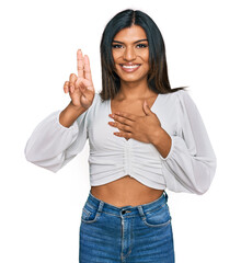 Young latin transsexual transgender woman wearing casual clothes smiling swearing with hand on...