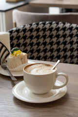 Cup of cappuccino on a table in a coffee shop