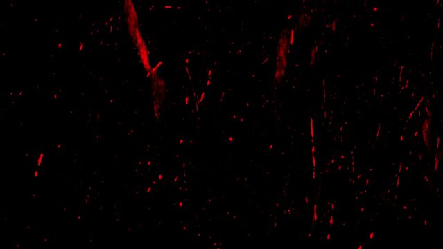 stop motion of red dot and splatters on black background