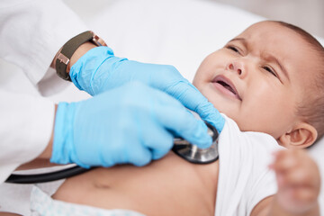 Baby, doctor and stethoscope for crying and heartbeat, checkup and lungs for healthcare in hospital. Pediatrician, medic and sad infant with heart problems for young person, hands and cardiology