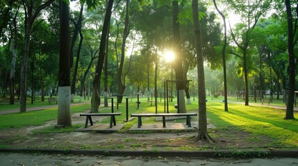 Fototapeta premium A park with a bench and a gazebo in the distance. Lush green grass and trees provide a peaceful atmosphere