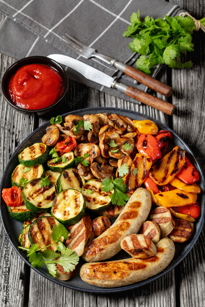 Sticker grilled white sausages with veggies and mushrooms