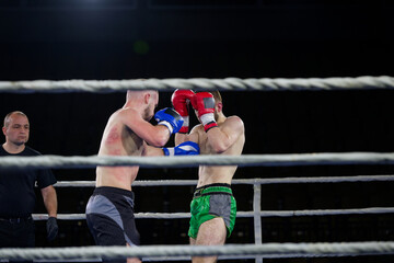 Fierce boxing match showcases athletes' power and skill.