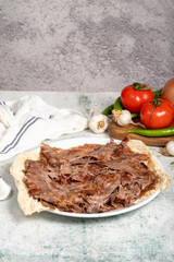 Meat Doner. Traditional Turkish cuisine taste. Cooked meat doner kebab on gray background. local name et doner. Close up