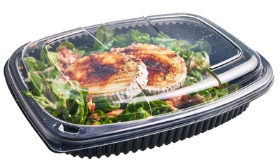 Container featuring grilled chicken, salad, and dressing, ready for takeaway or delivery.