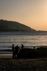 Family on the beach at sunset A Coruña Galicia