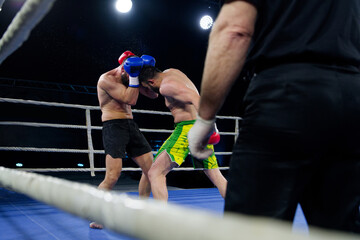 Fierce boxing match showcases athletes' power and skill.