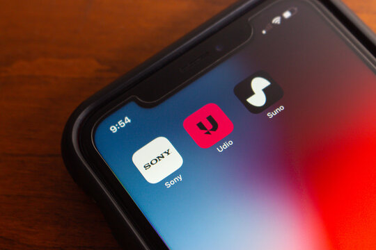 Vancouver, CANADA - Jul 4 2024 : Sony, Udio and Suno logos seen in an iPhone. Sony Music Entertainment has filed lawsuits against AI music generation companies Suno and Udio