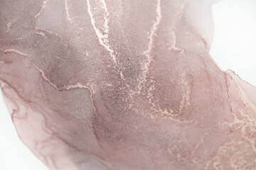 A close-up of an abstract painting with swirling patterns of rose gold ink on a white background