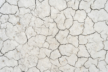 Detailed view of arid cracked sand texture