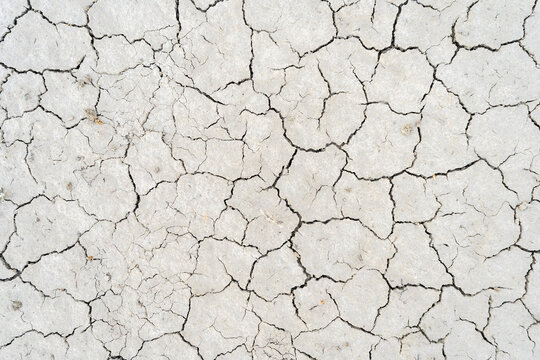 Detailed view of arid cracked sand texture