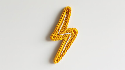 Crochet yellow lightning bolt badge on a white background  