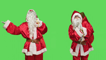 Saint nick does prayer hands sign to ask for forgiveness, carrying iconic sack filled with gifts or presents. Spiritual december character praying to god against greenscreen background.