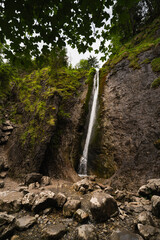 Siklawica waterfall in the Polish national park in Zakopane, vertical photo on a summer day.