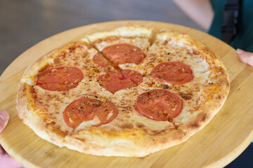 Freshly baked flatbread served on a wooden board is appealing to any food lover