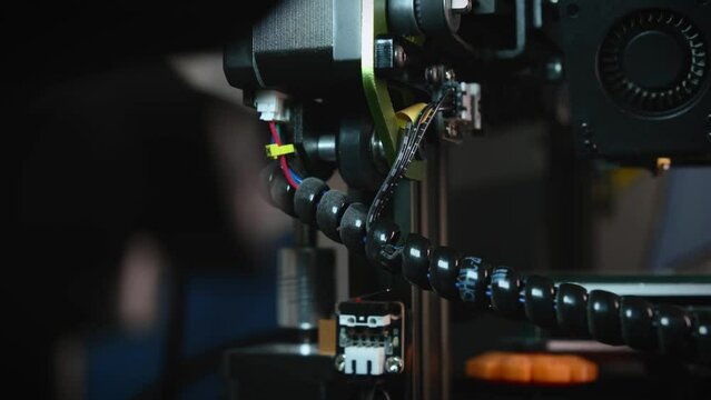 Detailed view of a 3D printer part, highlighting the mechanical and electronic components essential for 3D printing technology.