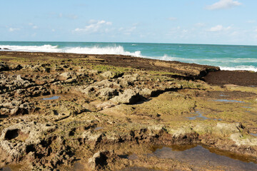 The Rocky Coastline at low tide at Cunhau Beach near Pipa Beach in the State of Rio Grande do Norte, Brazil