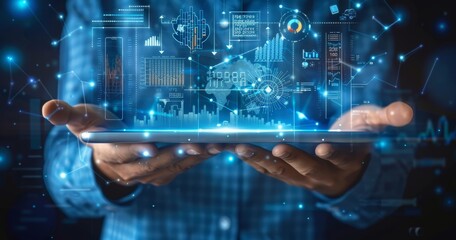 Fototapeta premium Business person holding an iPad, with digital graphs and icons floating above it, representing data analysis in the financial industry. The background is a blue gradient that transitions from light