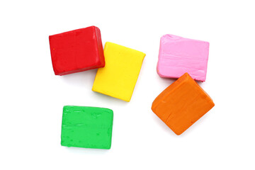Colorful plasticine clay on white background.