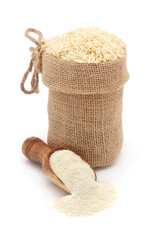 Close-up of Organic White rice (Oryza sativa), in a jute bag and Rice Flour on a scoop, Isolated on...