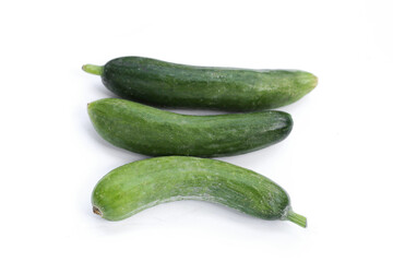 Mini cucumbers on white background.