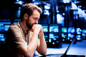 Engineer dealing with data center system failures, ordering servers with high availability features to minimize downtime. Expert installing redundant power supplies to prevent crashes