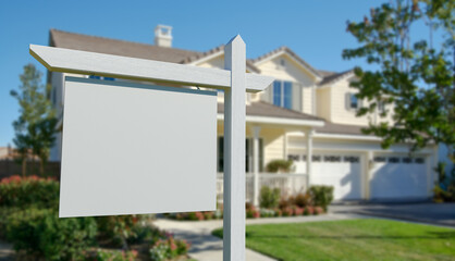 Blank Real Estate Sign in Front of Beautiful House.