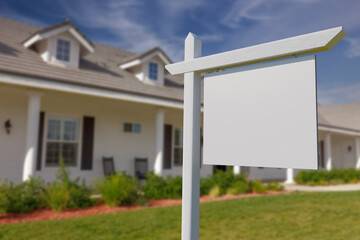 Blank Real Estate Sign in Front of Beautiful House.