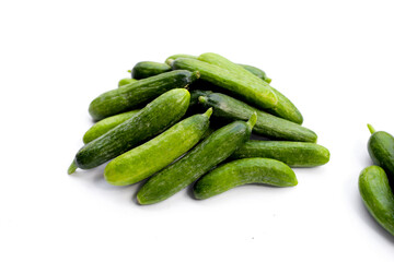 Mini cucumbers on white background.