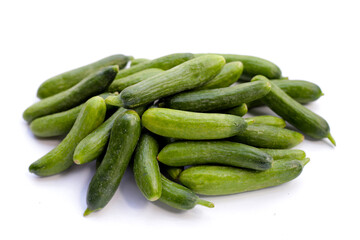 Mini cucumbers on white background.
