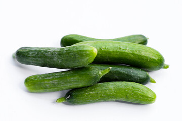 Mini cucumbers on white background.