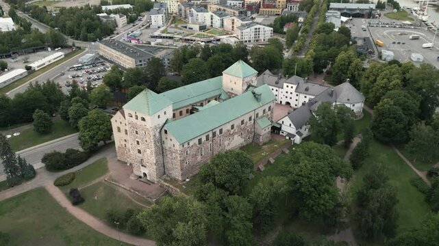 Establishing aerial footage of the Turku Castle, a medieval stone structure located in Turku, Finland.