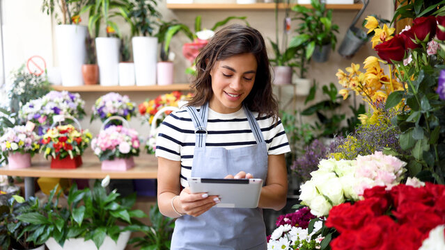 Smiling florist enjoying while running her business