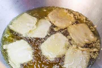 close up of tempeh fried in a frying pan