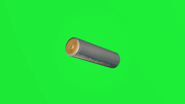 Alkaline battery spinning isolated on green screen background