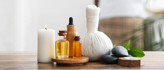Composition with spa accessories and bottles of cosmetic products on wooden table