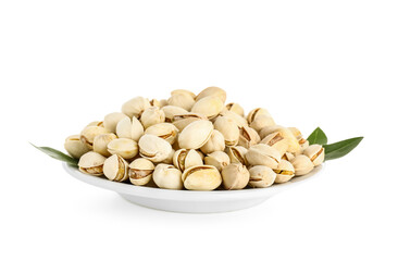 Plate with tasty pistachio nuts and leaves on white background