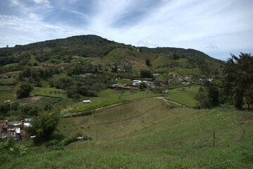 Obraz premium landscape, field, nature, grass, sky, green, rural, agriculture, countryside, meadow, farm, summer, hill, road, country, tree, hills, spring, view, trees, village, fields, land, cloud, scenery